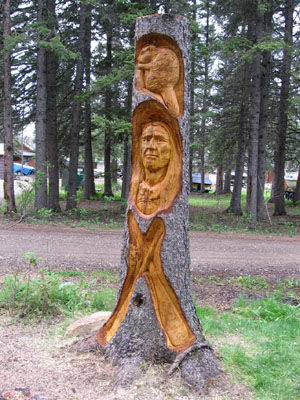 Spruce Carving Grey Owl in Waskesiu - 2 m x 30 cm  (7 x 1 ft)